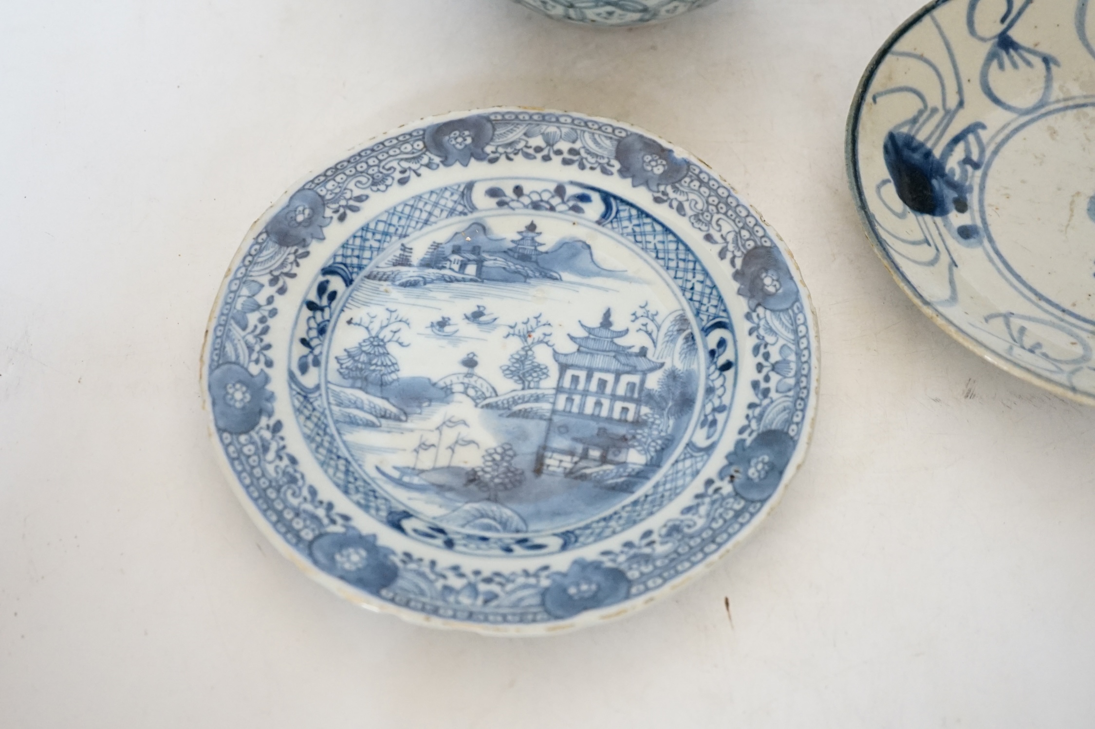 A Chinese Ming blue and white bowl and two Qing dynasty dishes, largest 17cm diameter